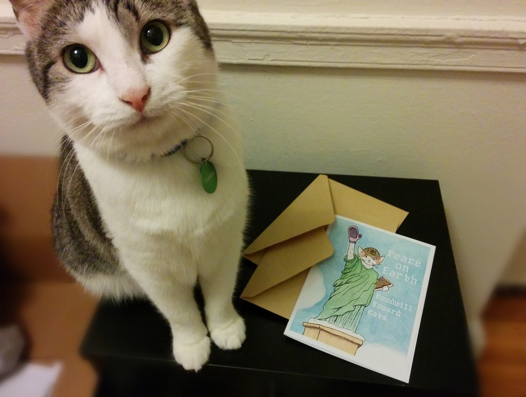 Inspector Scrambles poses with a card of her as the Statue of Liberty